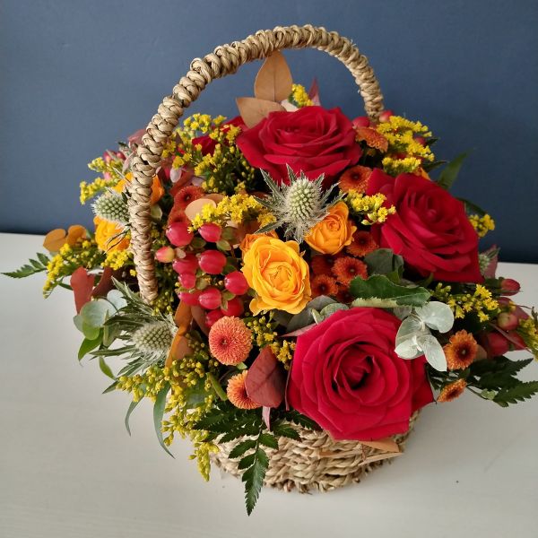 Arrangements by Emma of Floriana Floristry containing red, yellow and orange flowers