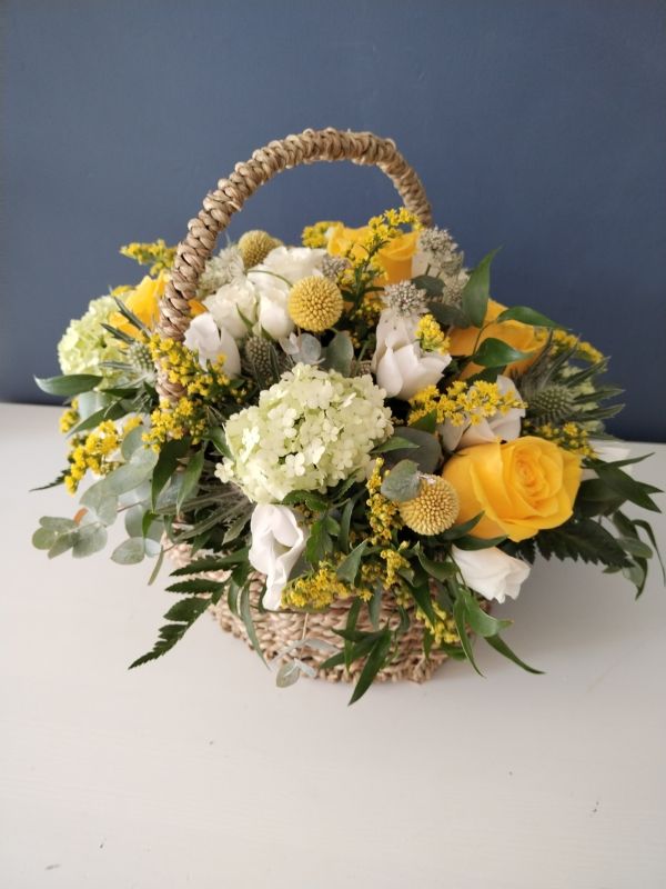 Floriana Floristry Gift Basket with yellow and white flowers in wicker basket
