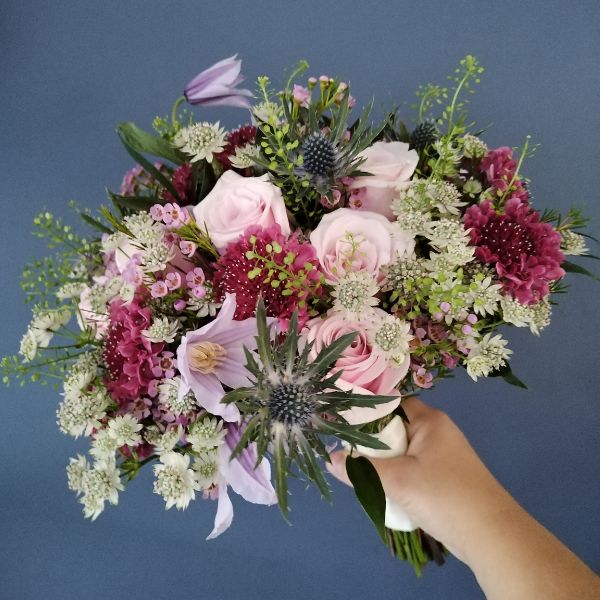 Wedding bouquet by Emma of Floriana Floristry containing pink and lilac flowers